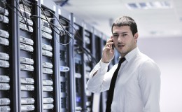 It engeneer talking by phone at network room